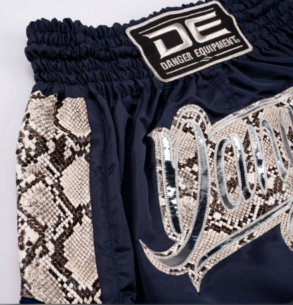 A collection of boxing and Muay Thai equipment including gloves, punching bag, and hand wrap made in Thailand, top bands such as Fightworld, Yuth, Danger, WBC, BKFC, Shinguards, Muay Thai, MMA Shorts and Equipments.